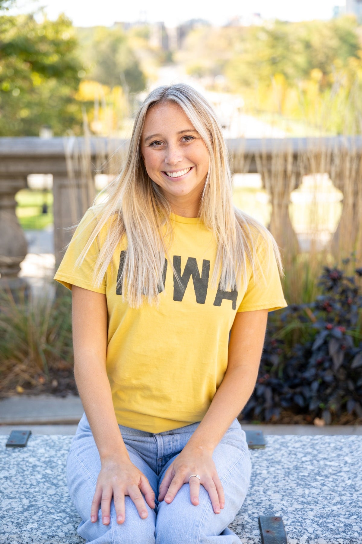 Woman wearing Catherine’s exclusive Retro Brand Iowa Hawkeyes vintage collegiate tee in Iowa City
