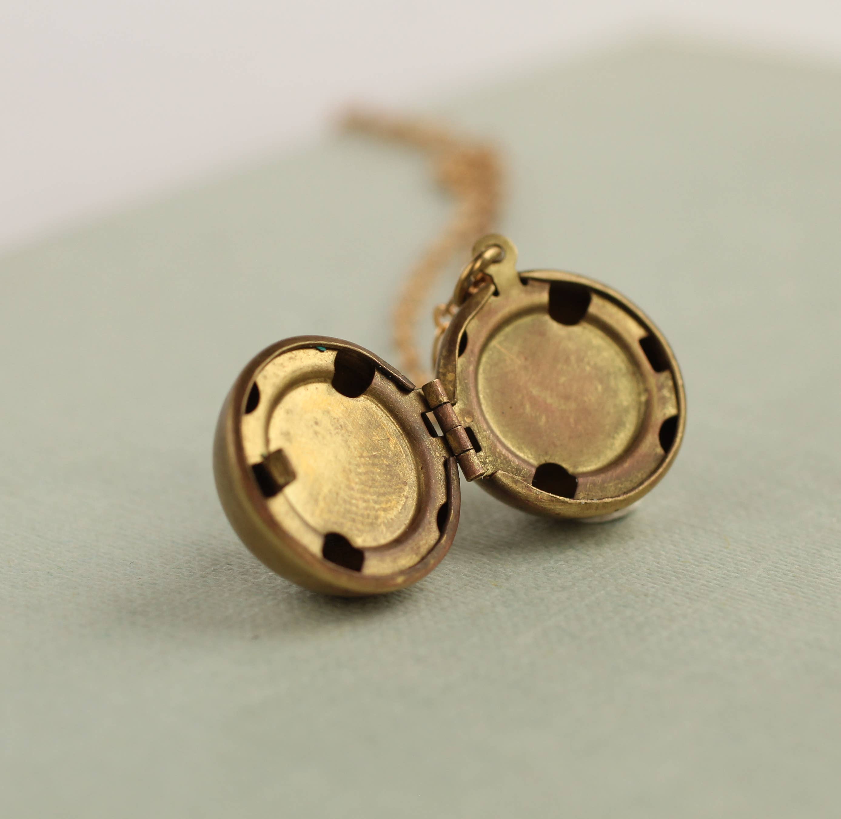 Silk Purse, Sow’s Ear Brass Sphere Locket Necklace