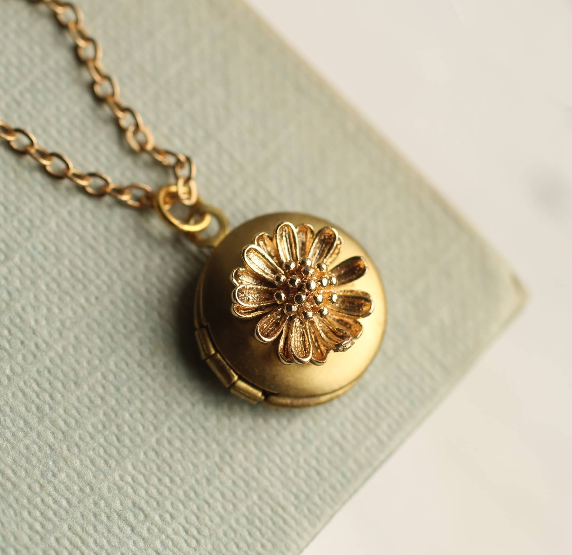 Silk Purse, Sow’s Ear Tiny Gold Daisy Locket