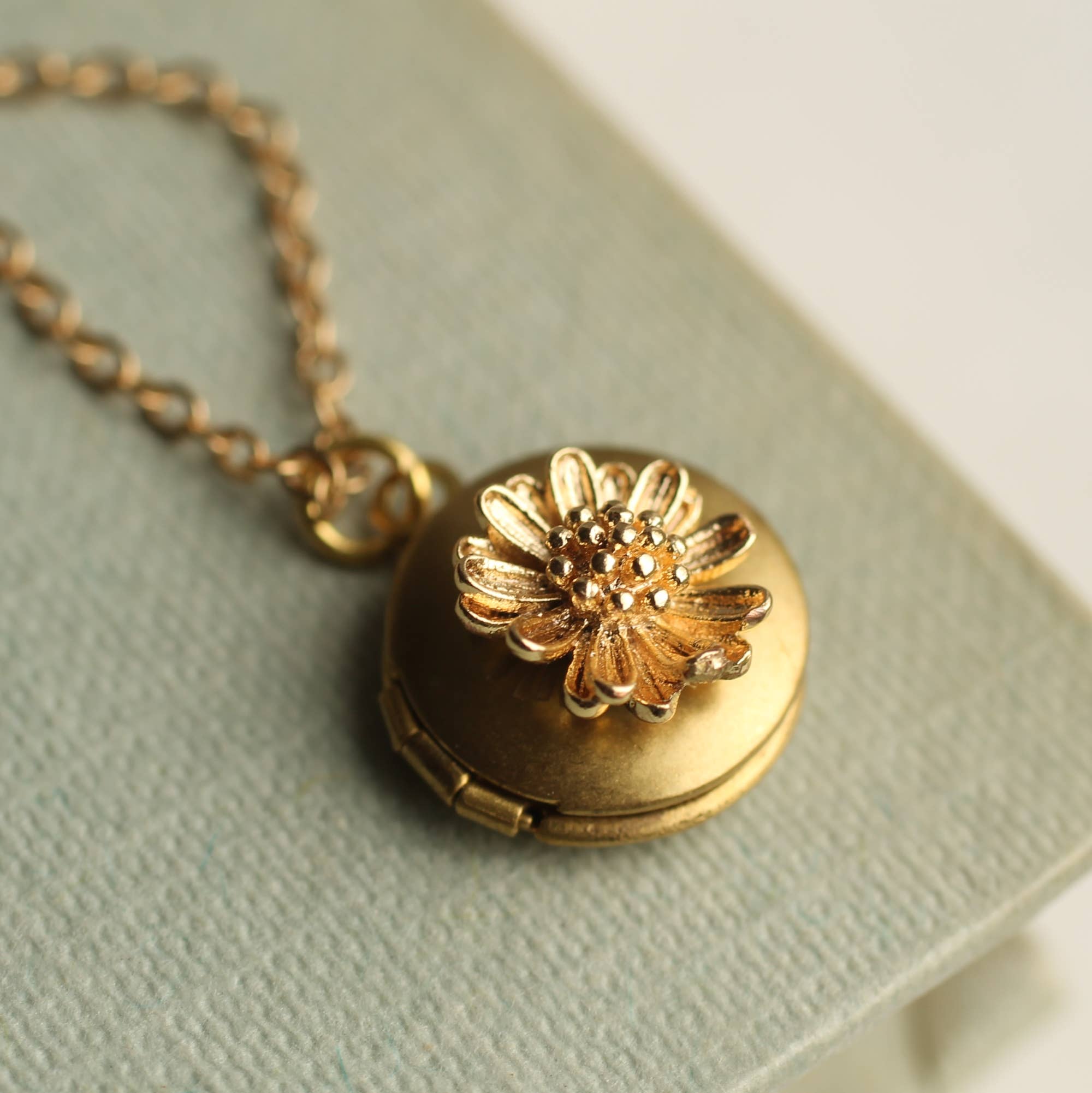 Silk Purse, Sow’s Ear Tiny Gold Daisy Locket